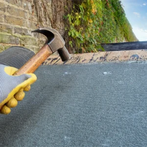 shed-or-roof-felt-being-fitted-on-a-shed-2024-10-17-14-20-07-utc