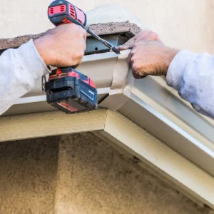 workers-attaching-aluminum-rain-gutter-to-fascia-o-2024-09-11-23-01-51-utc